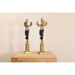 A pair of French Empire ormolu and bronze candelabra,