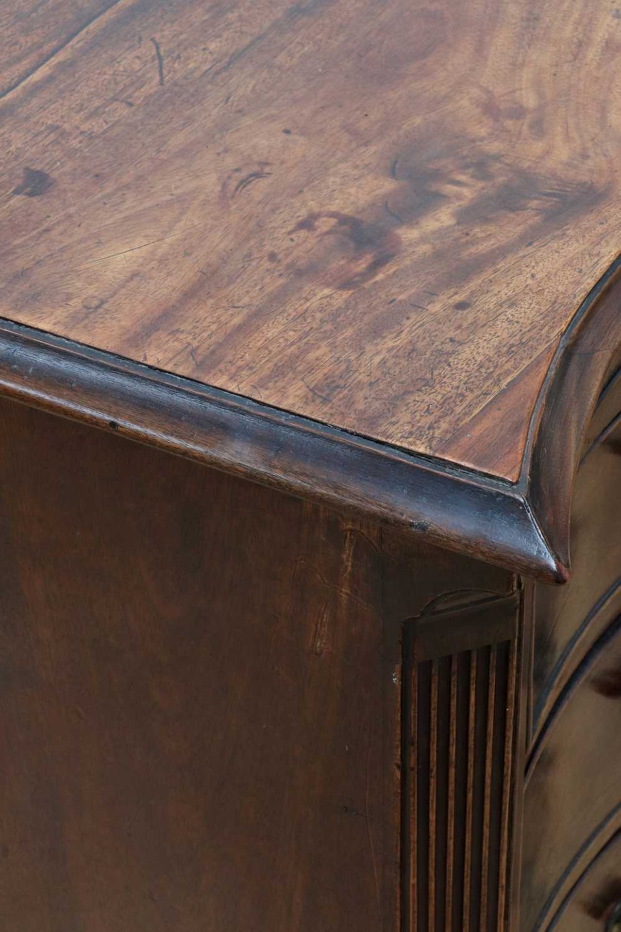A George III serpentine mahogany chest of drawers, - Image 6 of 11
