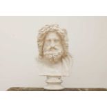 After the antique, a massive plaster bust after Zeus of Otricoli,