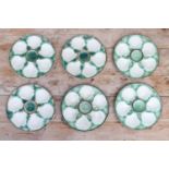 A set of eighteen Longchamp majolica oyster plates,