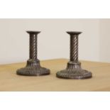 A pair of George III silver candlesticks,