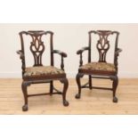 A pair of Irish mahogany open armchairs,