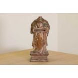 A carved wood reliquary figure of St Denis the Martyr,
