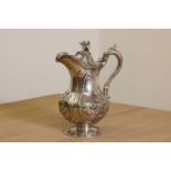 A Victorian silver hot water jug with ivory insulators,