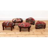 A collection of kilim-upholstered footstools