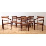 A matched set of eight Anglo-Indian Regency-style teak dining chairs