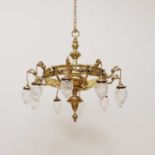 A large brass ten-branch ceiling light,