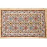 A needlepoint rug,