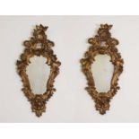 A pair of rococo wall mirrors,