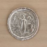 A silver Guardian Assurance Fireman's badge,