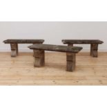 A set of three composite stone benches,