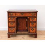 A George II burr elm and rosewood crossbanded kneehole desk,