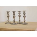A set of four George IV silver candlesticks,