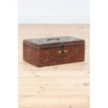 A red leather and studded deeds box,