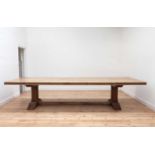 A large blonde oak refectory table,