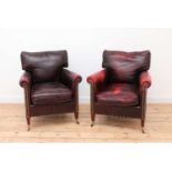 A pair of club armchairs,