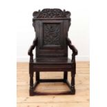 An oak wainscot armchair,