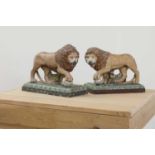 A pair of large pearlware lions,