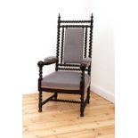 A Victorian ebonised barley twist armchair,