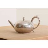 A Victorian silver teapot with ivory insulators,