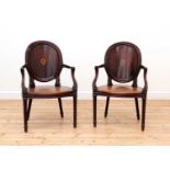 A pair of mahogany hall chairs,