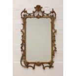 A George III-style carved giltwood wall mirror,