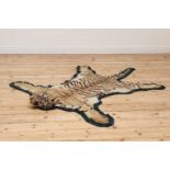 A full head tiger skin rug,