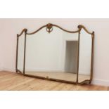 A large gilt-framed overmantel mirror,