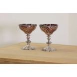 A pair of Victorian silver combination candlestick tazzas,