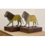 A pair of painted folk art lions,