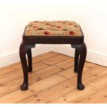 A George III mahogany stool,
