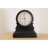 A black marble drumhead mantel clock,