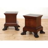 A pair of simulated mahogany pedestals,