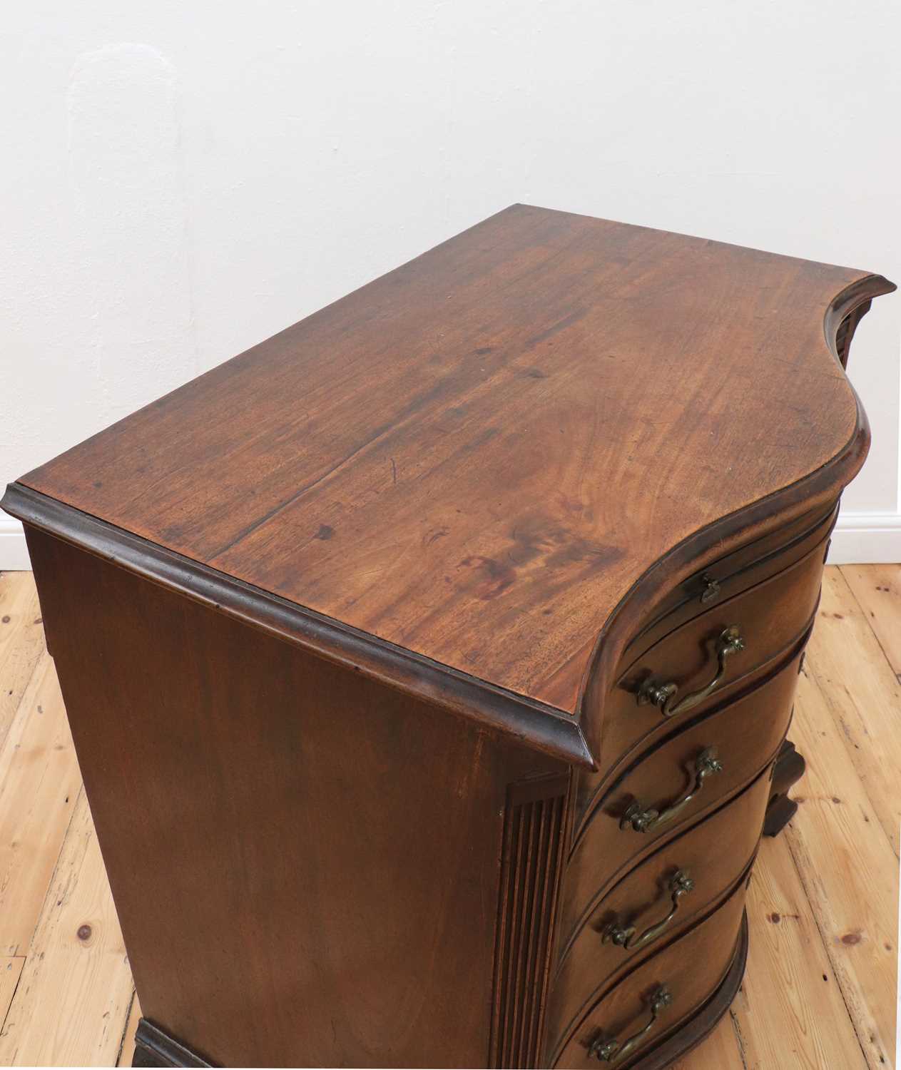 A George III serpentine mahogany chest of drawers, - Image 5 of 11