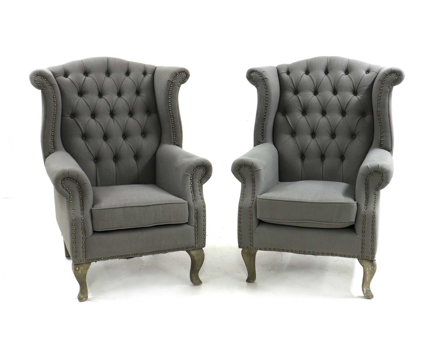 A pair of Queen Anne style wingback chairs,