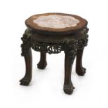 A Chinese carved hardwood jardiniere stand