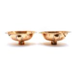 A pair of hammered copper basins,