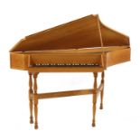 An oak spinet piano,