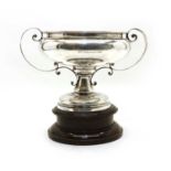 A silver twin handled presentation cup,