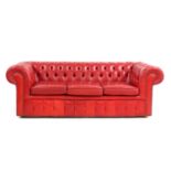 A red leather Chesterfield settee,