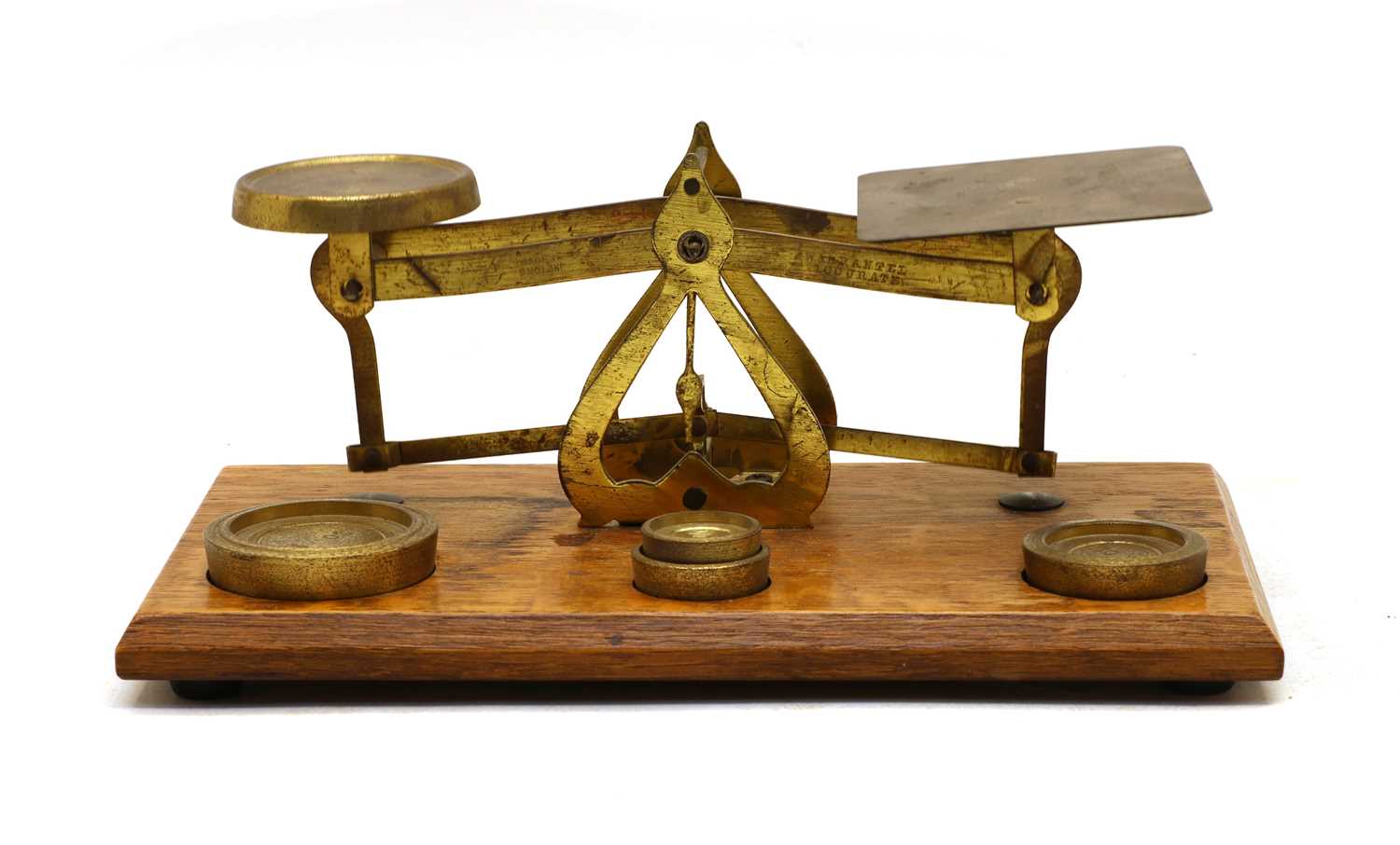 An Edwardian gilt brass postal scale,