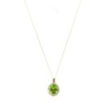 A gold peridot and diamond cluster pendant,