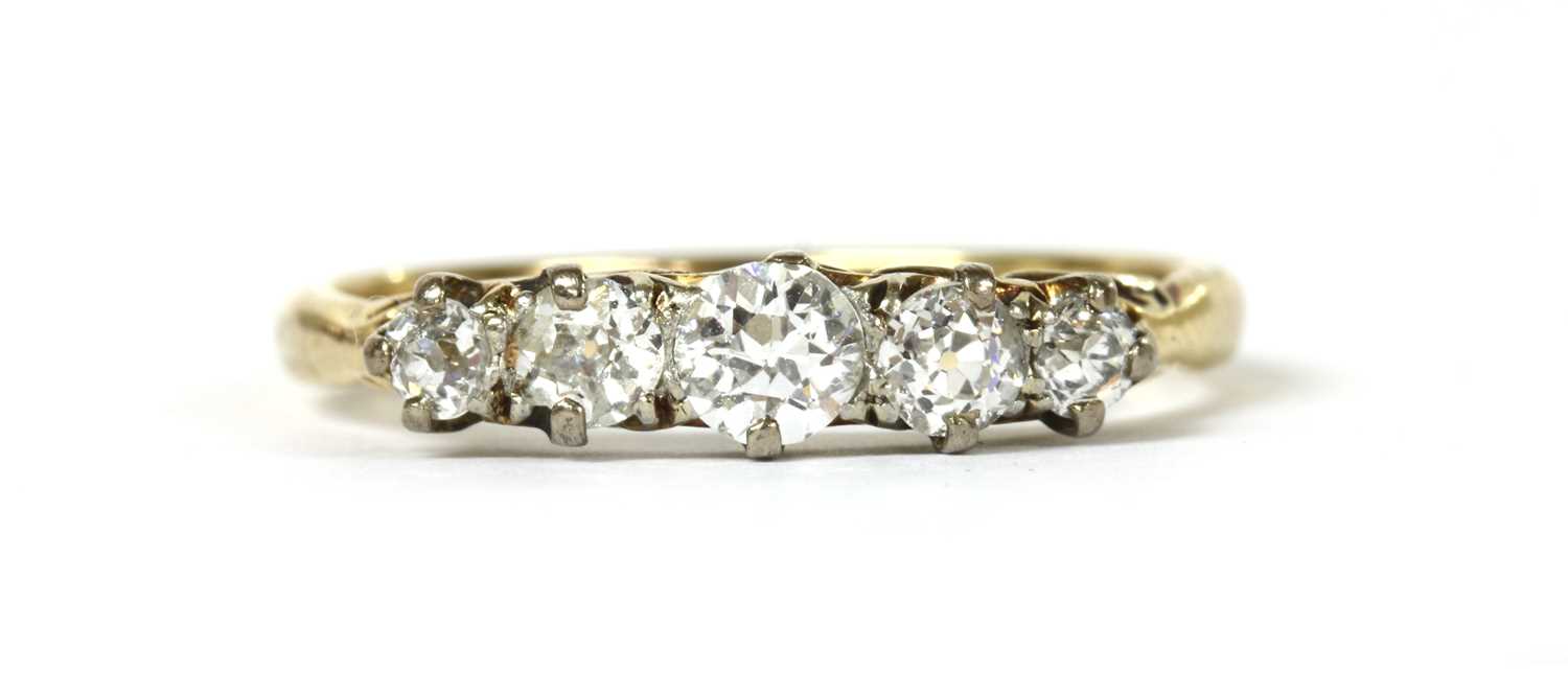 A gold five stone diamond ring,