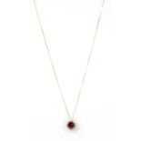 A gold fracture filled ruby and diamond cluster pendant,