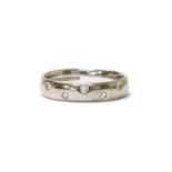 An 18ct white gold diamond set wedding ring,