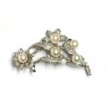 A cultured pearl and diamond spray brooch,