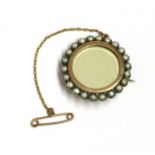 A gold and silver, split pearl set brooch,