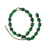 A silver two row green paste bracelet,