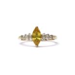 A gold yellow sapphire and diamond ring,