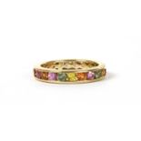 A gold varicoloured sapphire full eternity ring,